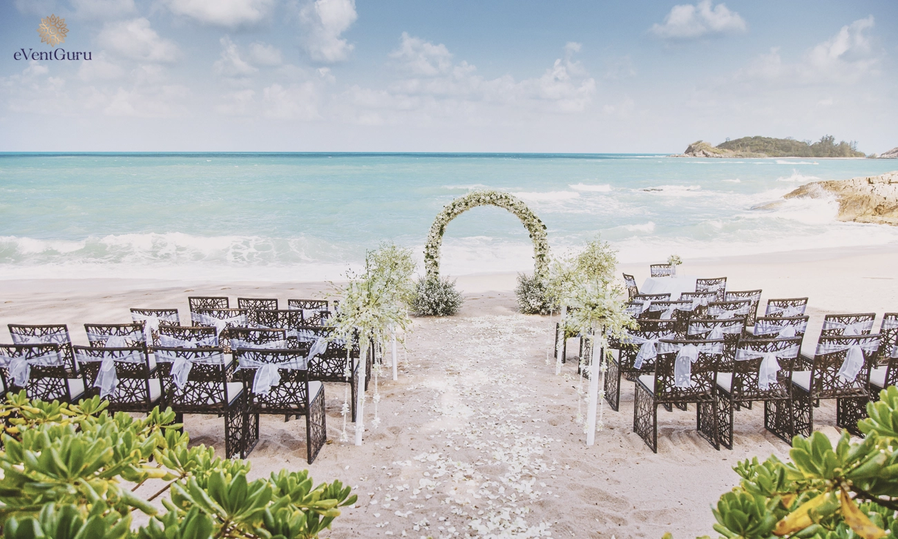 The beach wedding venue is beautifully decorated with flowers